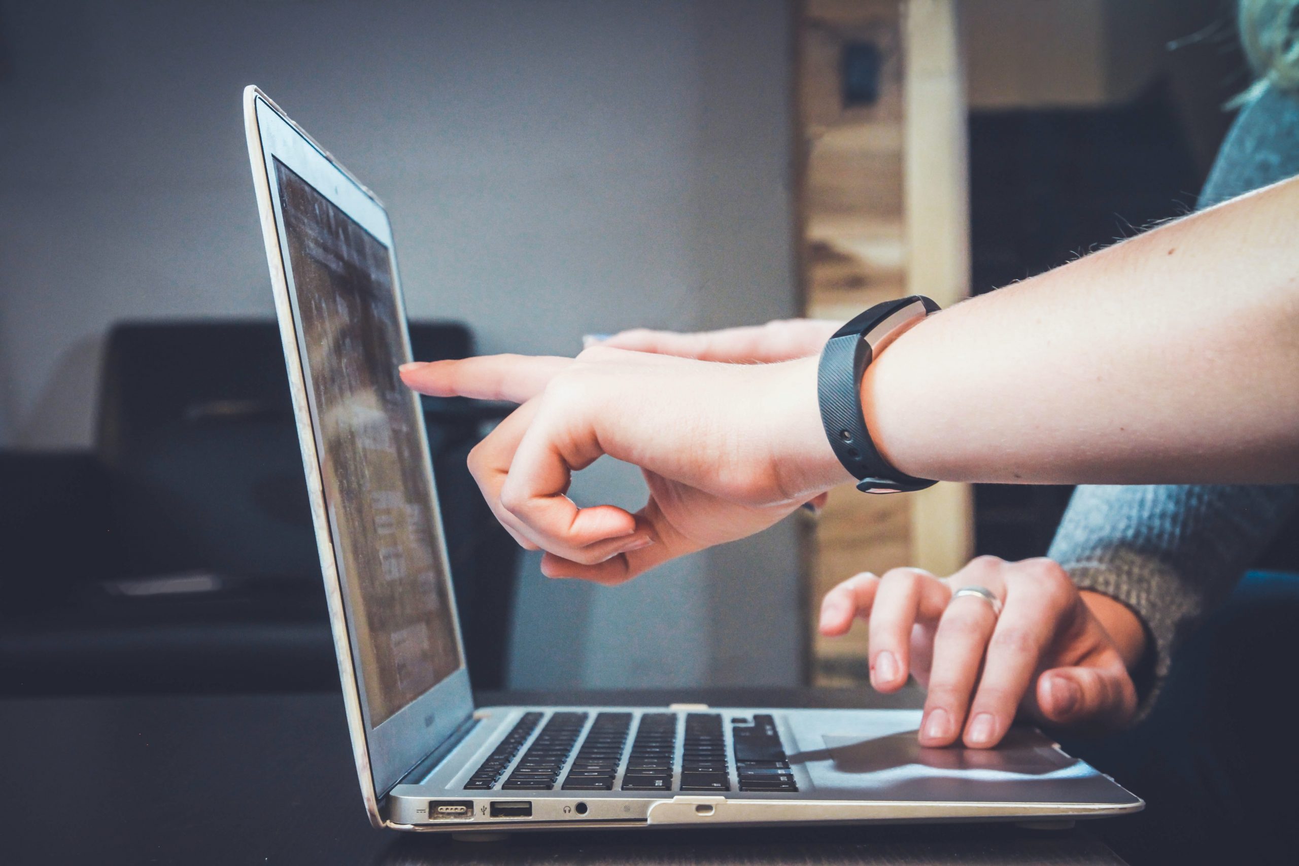 Two digital marketing experts using laptop